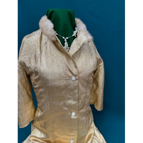 340B - A 1950's or early 60's high hollywood fashion  gold lamé with champagne collar, long evening coat  b... 