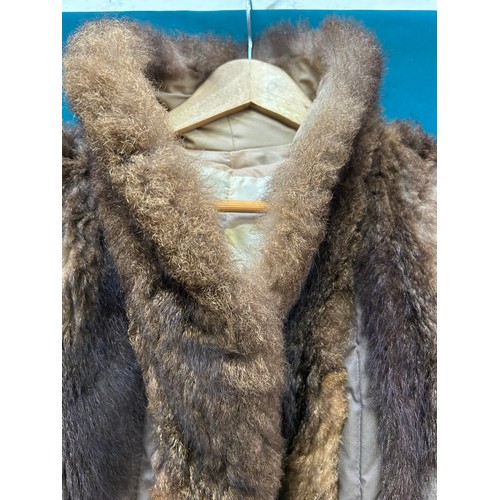 340C - An early 1960's quilted and lambs skin haute couture apres ski cape and coat, with removable  lining... 