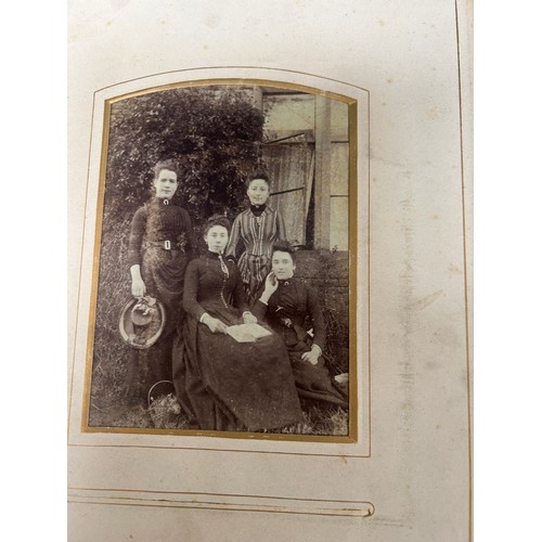 166A - A Victorian and Edwardian carte de visite photograph album with studio portraits, family groups, sch... 