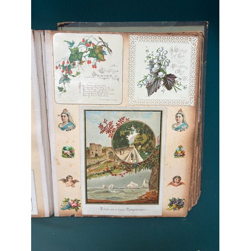 167 - A Victorian Scrap Album and over 30 Randolph Caldecott postcards. Album includes Christmas Cards, sc... 