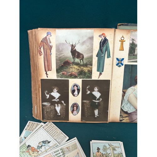 167 - A Victorian Scrap Album and over 30 Randolph Caldecott postcards. Album includes Christmas Cards, sc... 