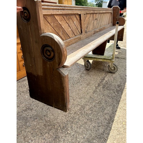 466 - Large Victorian pitch pine church or chapel pew with decorative roundels to the ends - 320cm