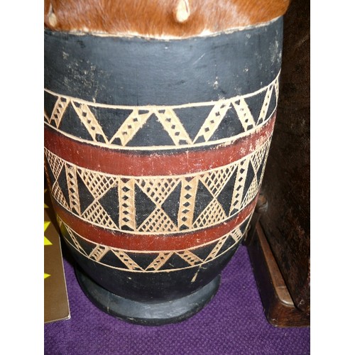 237 - AN AFRICAN TRIBAL DRUM WITH COW HIDE TOP