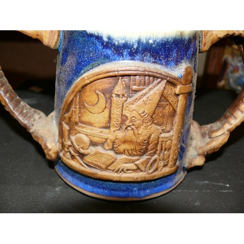 261 - A VINTAGE STONEWARE DOUBLE HANDED DRAGON MUG FEATURING WIZARDS