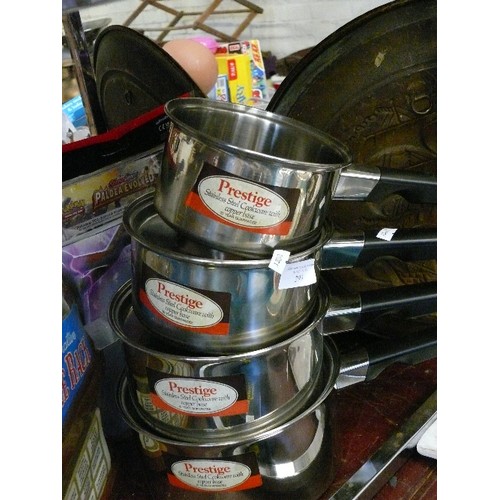 293 - A SET OF 4 STAINLESS STEEL, COPPER BASED PRESTIGE SAUCEPANS AND A NEW SPICE RACK