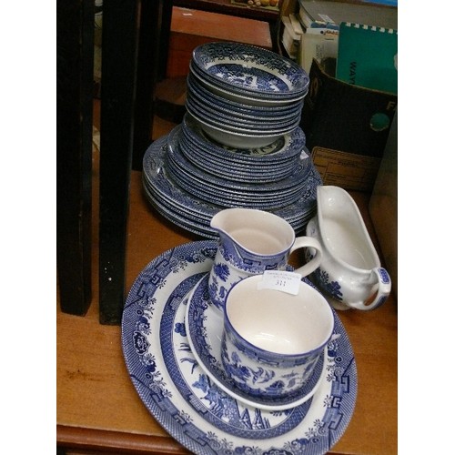 311 - A SELECTION OF BLUE AND WHITE WILLOW PATTERN CHINA