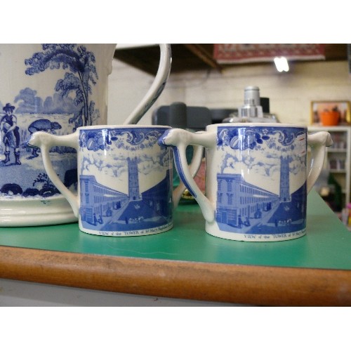 324 - A LARGE BLUE AND WHITE TANKARD AND 2 SMALLER BLUE AND WHITE MUGSALL MADE BY WADE POTTERIES FOR THE T... 