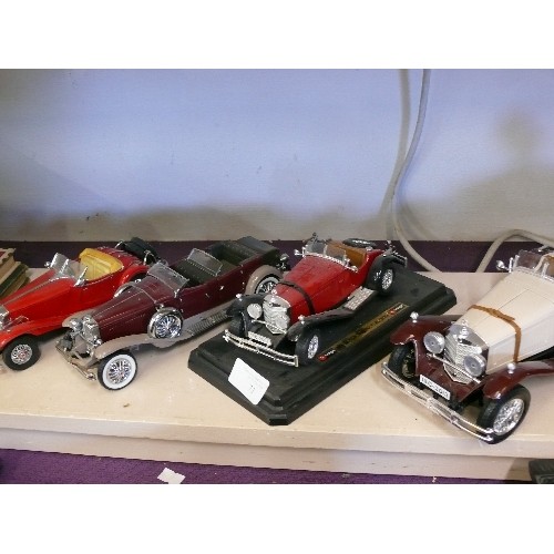 73 - 4 LARGE MODELS OF VINTAGE CARS BY BURAGO AND FRANKLIN MINT