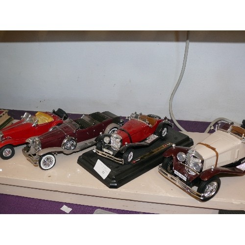 73 - 4 LARGE MODELS OF VINTAGE CARS BY BURAGO AND FRANKLIN MINT