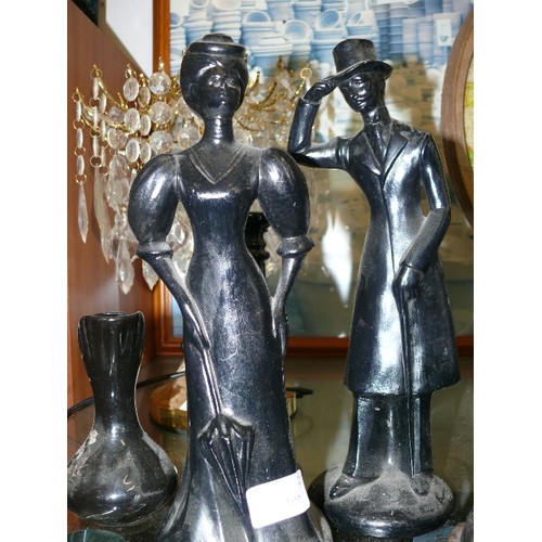 168 - A PAIR OF BLACK CERAMIC FIGURINES PLUS A CANDLESTICK AND A JUG