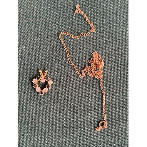 22 - A 9CT GOLD NECKLACE (1.5 GRAMS) TOGETHER WITH A HEART PENDANT AND A GOLD COLOURED CHAIN