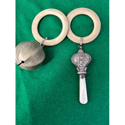 26 - TWO ANTIQUE TEETHING RINGS / RATTLES ONE WITH CONTINENTAL SILVER MARKS AND MOTHER OF PEARL TEETHER