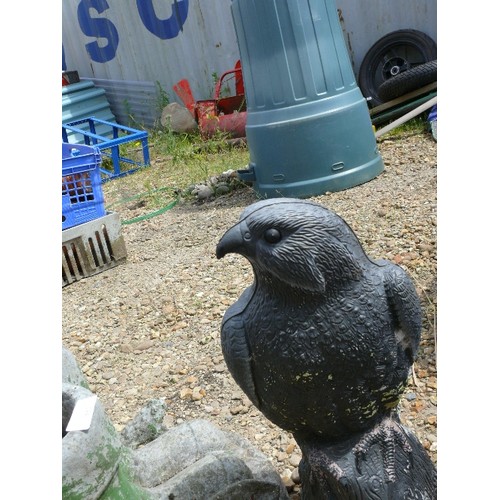 512 - A CONCRETE BOOT PLANTER AND A LARGE EAGLE ORNAMENT