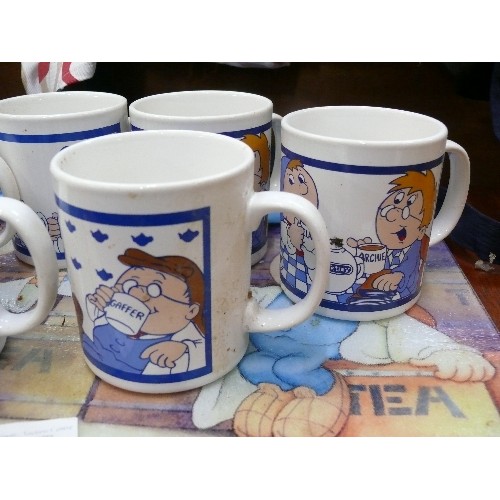 559 - TETLEY TEA 6 MUGS AND A GLASS TOP PLACE MAT