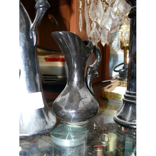 168 - A PAIR OF BLACK CERAMIC FIGURINES PLUS A CANDLESTICK AND A JUG