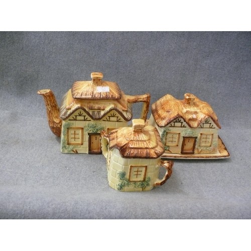 187 - THATCHED COTTAGE CERAMIC TEAPOT, CREAMER AND BUTTER DISH