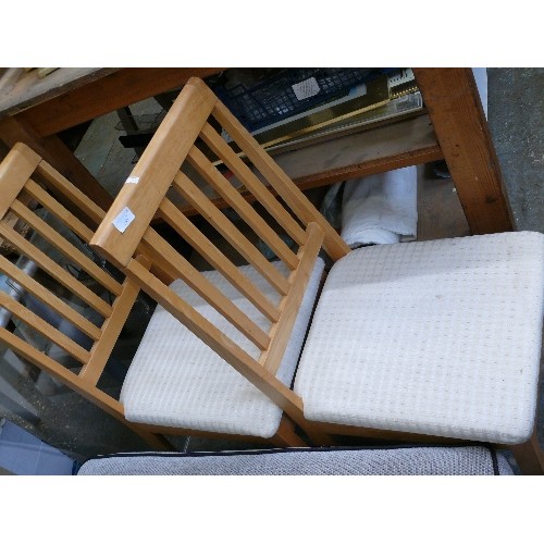 557 - PAIR OF PALE BEECH WOOD DINING CHAIRS WITH PADDED OATMEAL COLOURED SEATS