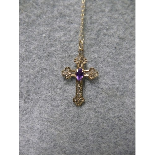 19 - A 9ct GOLD CHAIN WITH A CROSS AND PAPAL PURPLE STONE WEIGHT .92gr