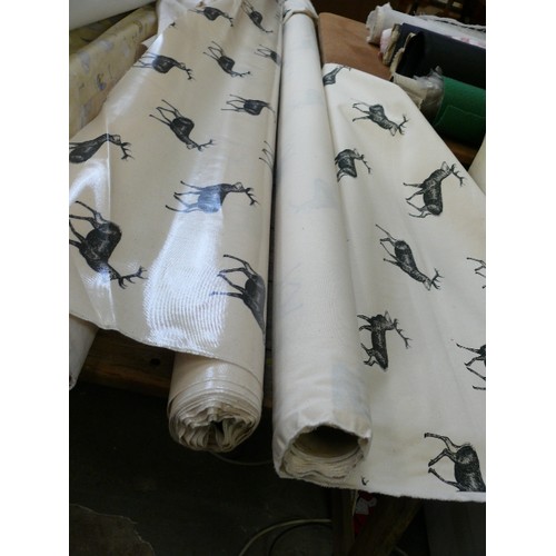 423 - 2 PART ROLLS OF STAG FABRIC 1 VINYL AND 1 COTTON