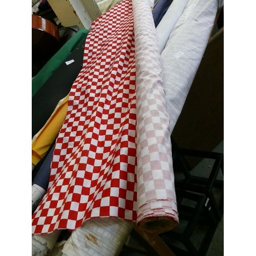 427 - A ROLL OF RED AND WHITE CHECK FABRIC