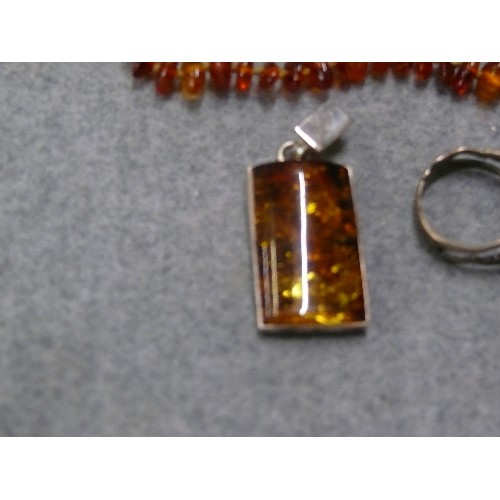 48 - THREE PIECES OF LOVELY AMBER - AN ART DECO SILVER RING, A BRACELET MADE OF BEADS OF AMBER AND A PEND... 