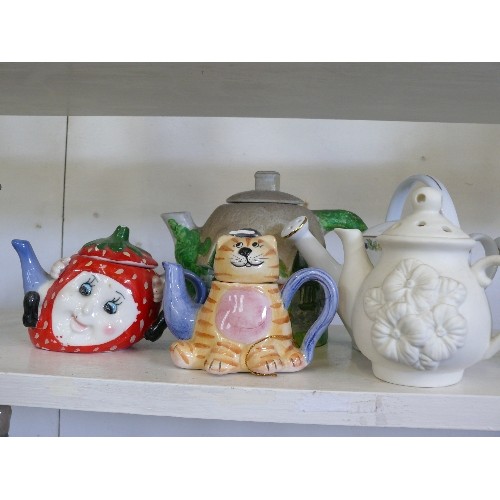 94 - A COLLECTION OF VARIOUS DECORATIVE TEAPOTS