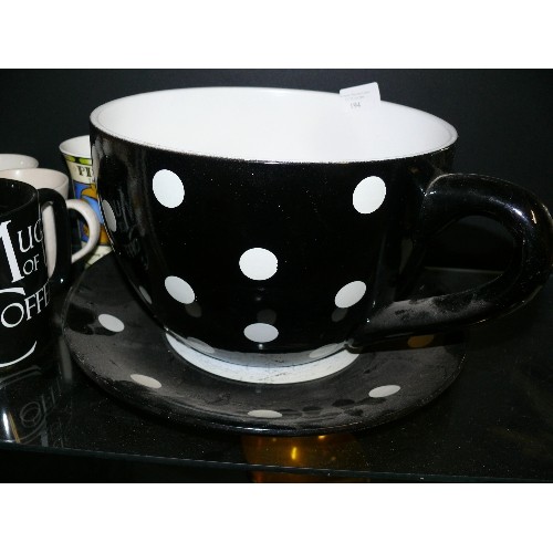 194 - A LARGE BLACK AND WHITE SPOTTY TEA CUP PLANTER PLUS A SELECTION OF VARIOUS MUGS