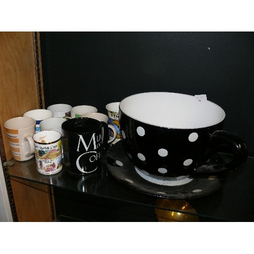 194 - A LARGE BLACK AND WHITE SPOTTY TEA CUP PLANTER PLUS A SELECTION OF VARIOUS MUGS