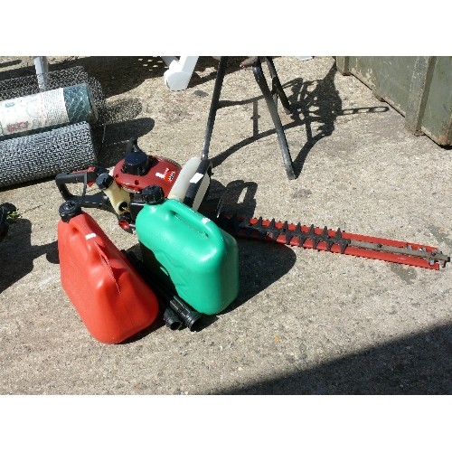 353 - A MOUNTFIELD PETROL HEDGECUTTER PLUS 2 PETROL CANS