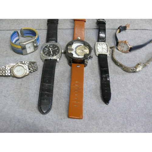 65 - A TUB OF MOSTLY GENTS GOOD QUALITY WATCHES