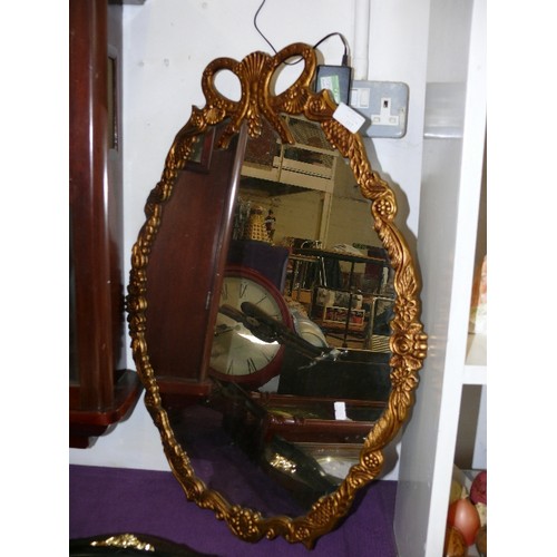 117 - A LARGE ORNATE GILT FRAMED MIRROR