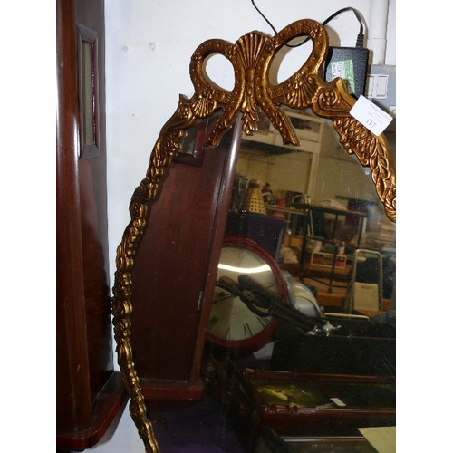 117 - A LARGE ORNATE GILT FRAMED MIRROR