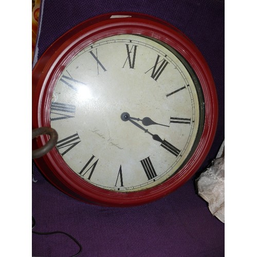 126 - A LARGE RED METAL WALL CLOCK LONDON ENGLAND