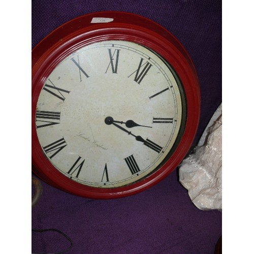 126 - A LARGE RED METAL WALL CLOCK LONDON ENGLAND