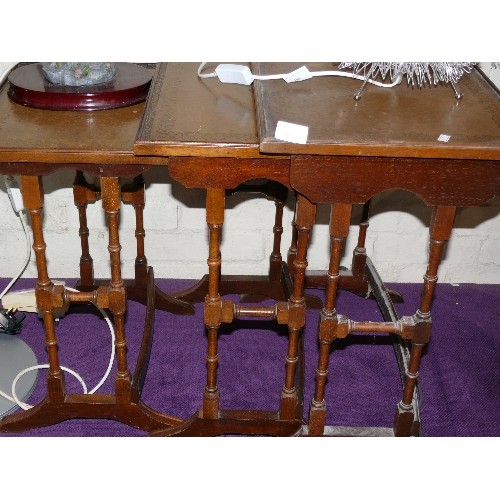 187 - A NEST OF 3 VINTAGE LEATHER TOPPED TABLES