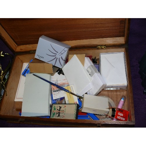 196 - A LARGE OAK STATIONERY BOX WITH CONTENTS OF STATIONERY