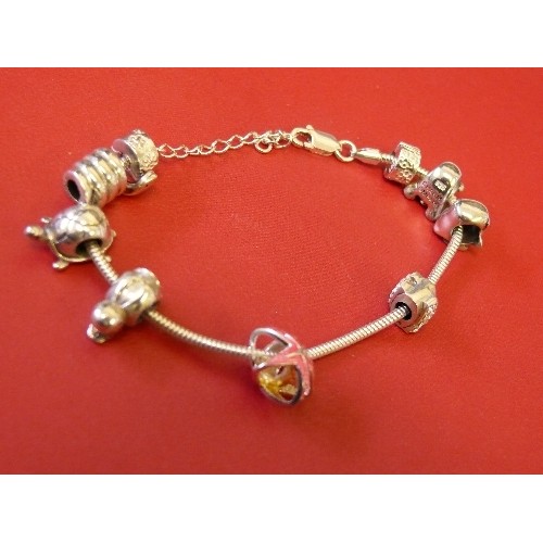 37 - A SOLID SILVER CHARM BRACELET