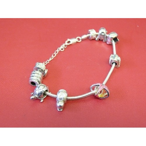 37 - A SOLID SILVER CHARM BRACELET