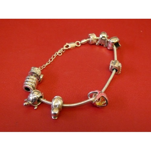 37 - A SOLID SILVER CHARM BRACELET