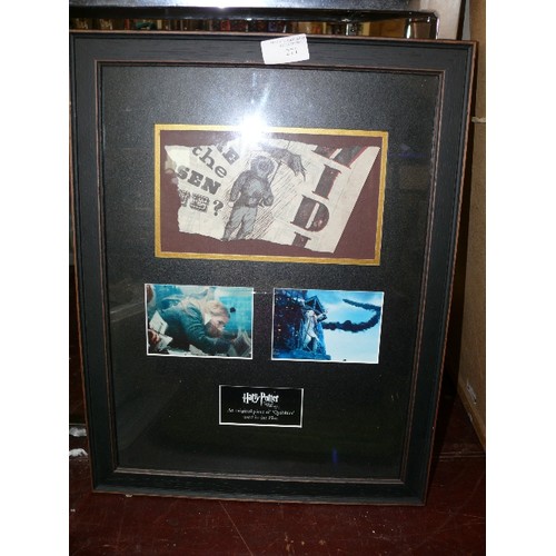 271 - A FRAMED AND GLAZED ORIGINAL PIECE OF 'QUIBBLER' USED IN HARRY POTTER AND THE DEATHLY HALLOWS PART 1