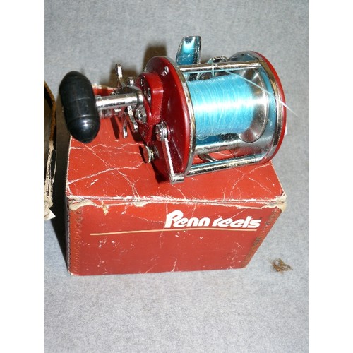 279 - A MITCHELL GARCIA 602P FISHING REEL AND A PENN 209MS FISHING REEL, BOTH BOXED