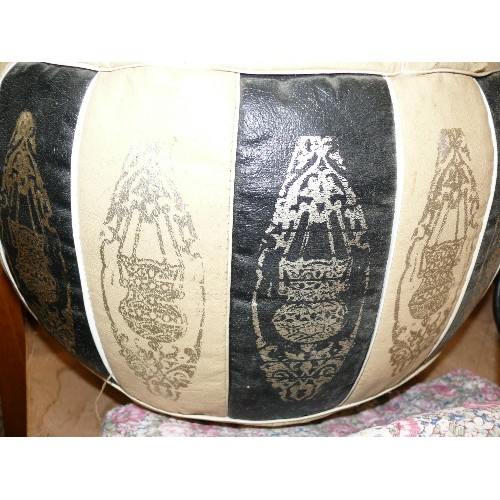 348 - A VINTAGE BLACK AND CREAM LEATHER EGYPTIAN POUFFE STOOL