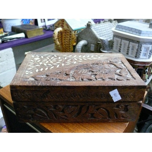 312 - A CARVED WOODEN BOX WITH CONTENTS OF SEWING ITEMS