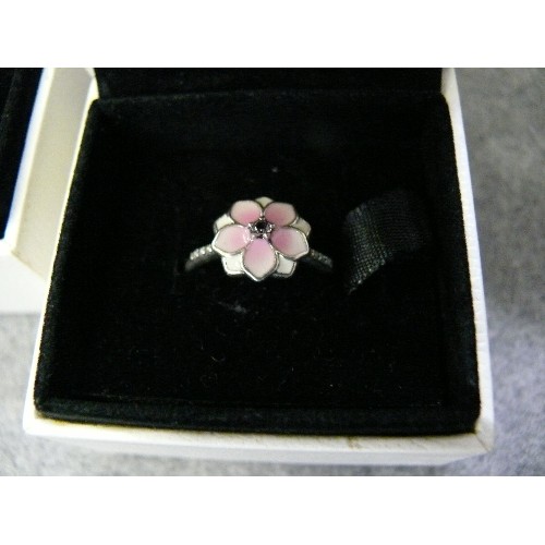 23 - 2 SILVER PANDORA RINGS 1 WITH ENAMEL FLOWER THE OTHER LIKE A CHARM RING