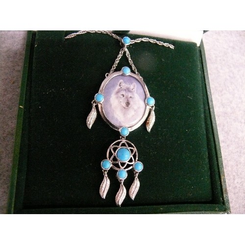 28 - A HEAVY SOLID SILVER PENDANT OF A WOLF WITH TURQUOISE DROPLETS BY ETHNIC AMERICAN INDIANS WITH SILVE... 