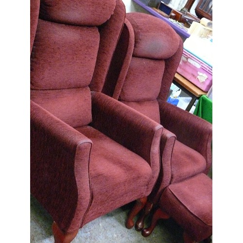 486 - HIS AND HERS FIRESIDE CHAIRS IN BURGUNDY, ONE WITH A FOOTSTOOL