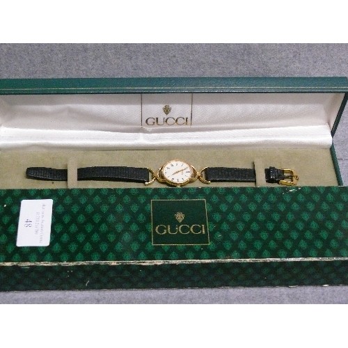 48 - A FINE GENUINE GUCCI CLASSIC STYLE WATCH HARDLY WORN HAS REG NUMBER 0213808 ,IN ORIGINAL BOX