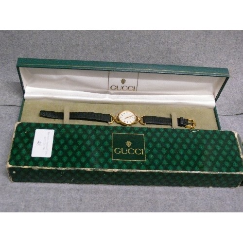 48 - A FINE GENUINE GUCCI CLASSIC STYLE WATCH HARDLY WORN HAS REG NUMBER 0213808 ,IN ORIGINAL BOX