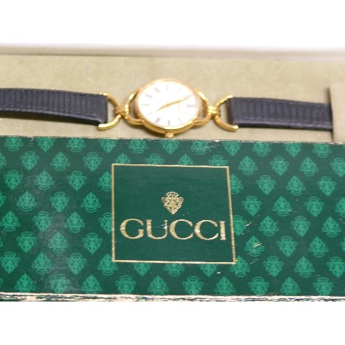 48 - A FINE GENUINE GUCCI CLASSIC STYLE WATCH HARDLY WORN HAS REG NUMBER 0213808 ,IN ORIGINAL BOX