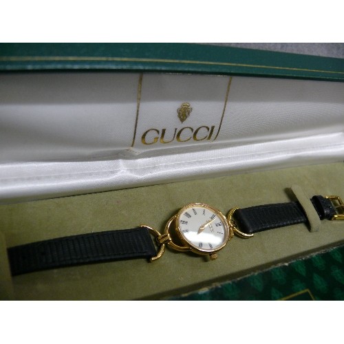 48 - A FINE GENUINE GUCCI CLASSIC STYLE WATCH HARDLY WORN HAS REG NUMBER 0213808 ,IN ORIGINAL BOX